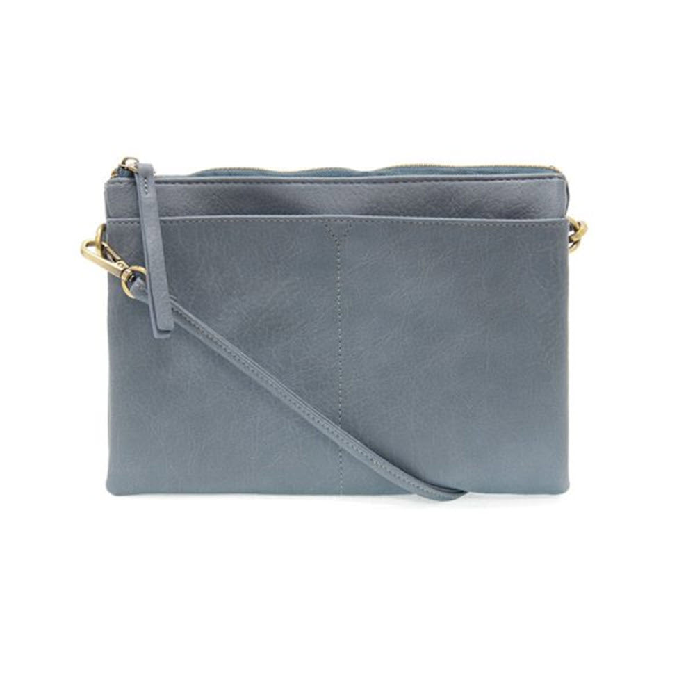 Gray denim Joy Susan Gia medium multi pocket bag with a removable strap and gold-tone hardware, isolated on a white background.