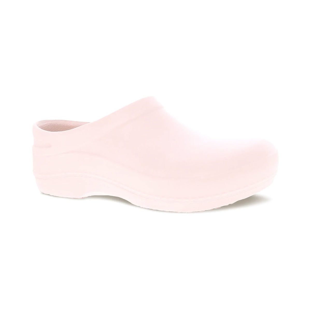 A single Dansko Kaci Pink clog shoe with a closed top and open back, featuring a slip-resistant rubber outsole, displayed on a white background.