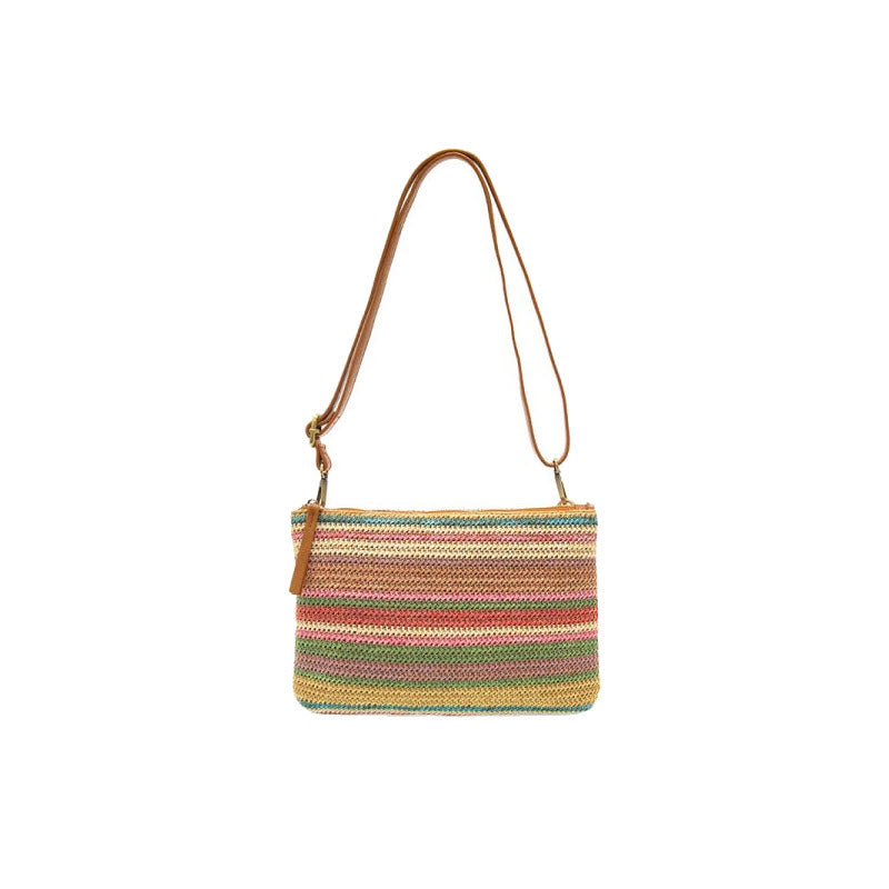 Striped fabric JOY SUSAN STRAW QUINN CROSSBODY SOFT MULTI shoulder bag with a brown leather crossbody shoulder strap, isolated on a white background.