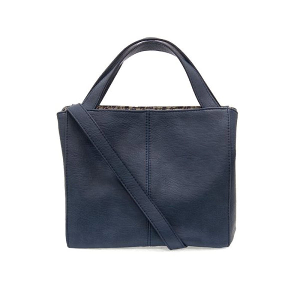 JOY SUSAN BRANDI CROSSBODY BRIGHT NAVY handbag with top handle and a shoulder strap, isolated on a white background.