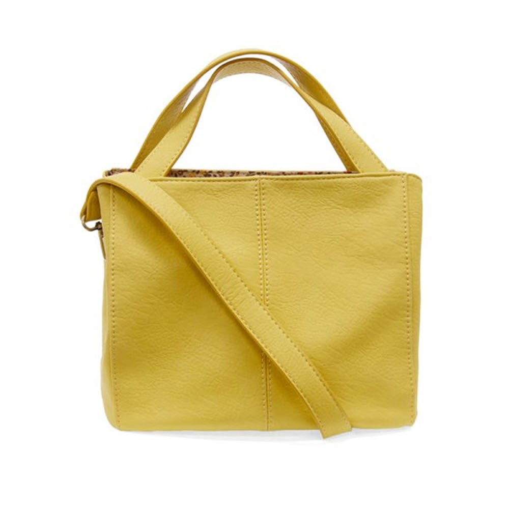 JOY SUSAN BRANDI CROSSBODY YELLOW vegan leather handbag with a crossbody strap and top handle, displayed against a white background.