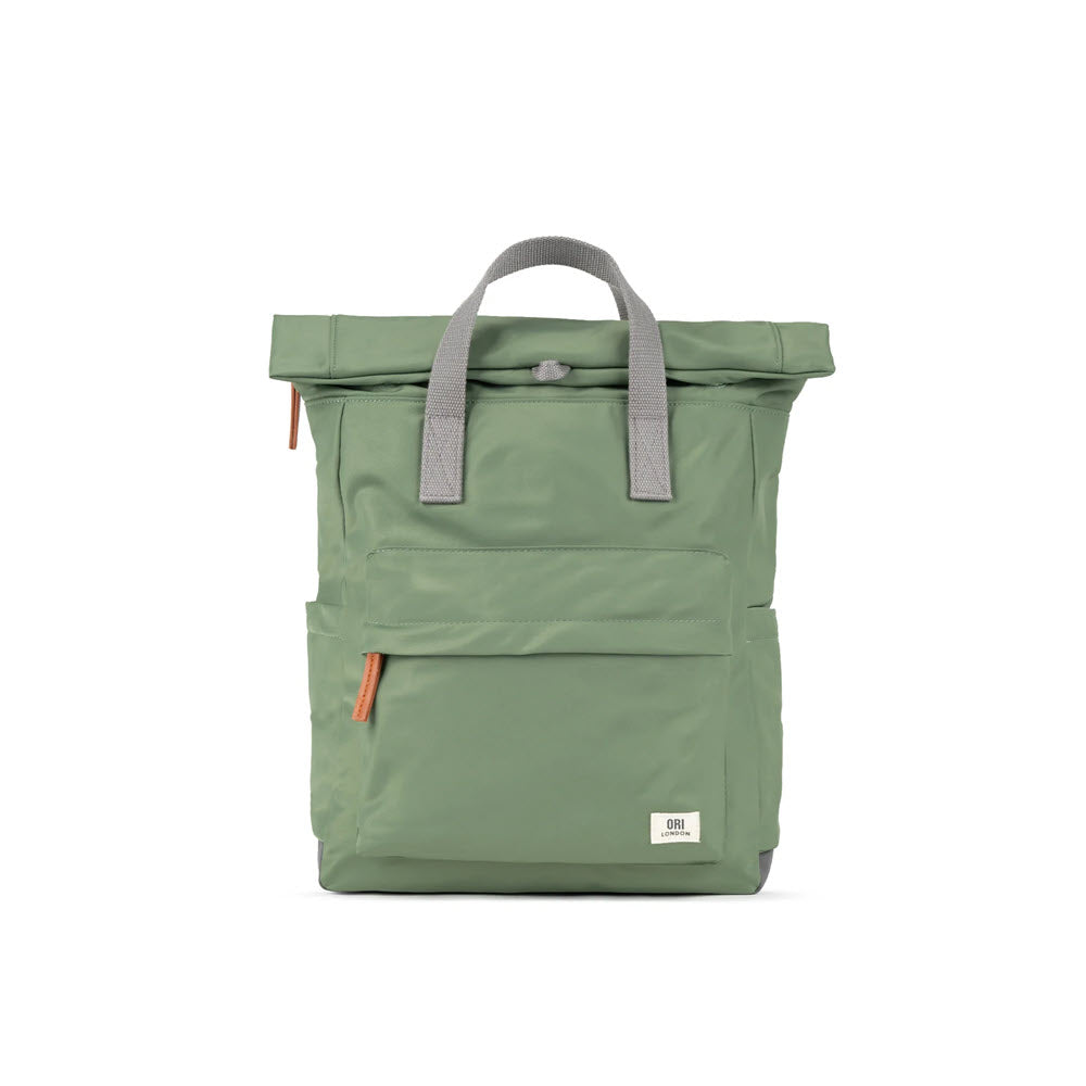 Light green ORI CANFIELD B MEDIUM NYLON GRANITE roll-top backpack with front zipper pocket and gray handles, featuring a secret pocket, displayed against a white background by Ori London.