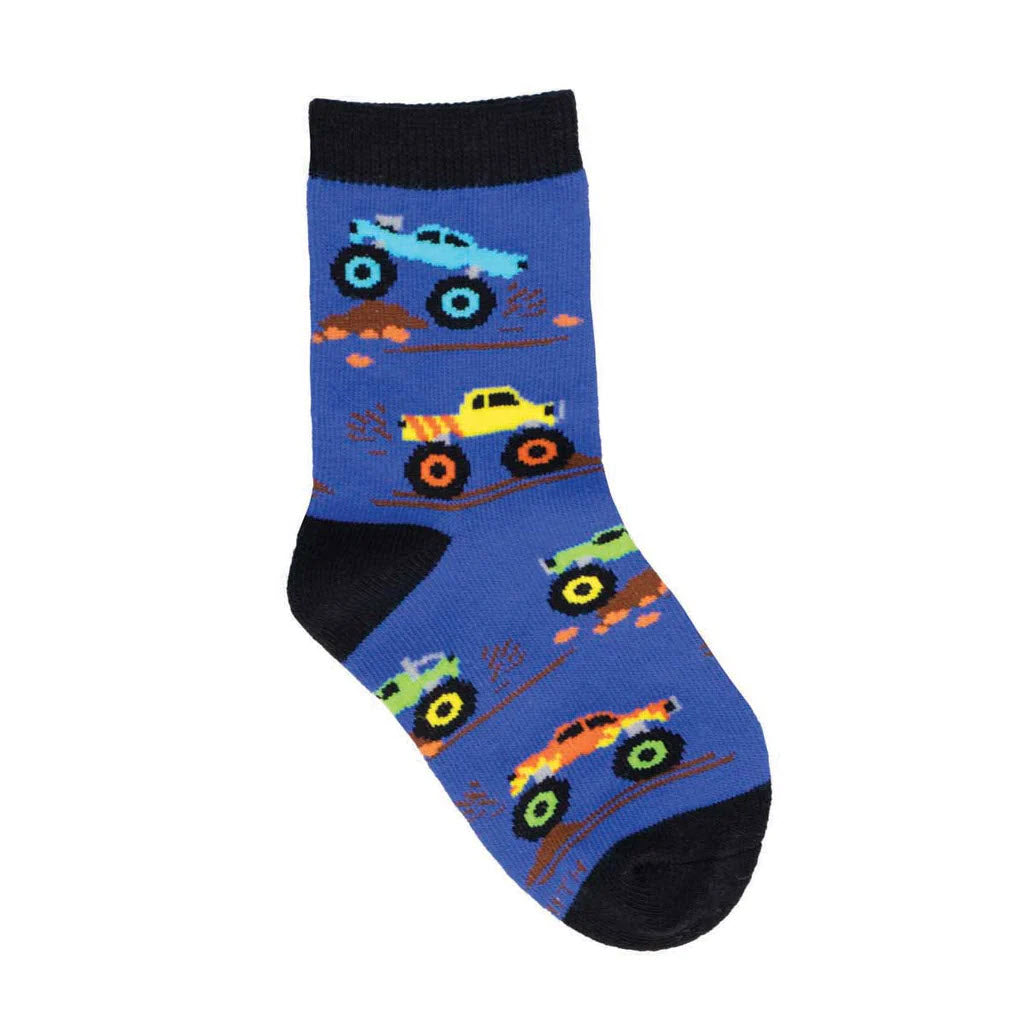 A child's blue Socksmith sock inspired by imagination, featuring colorful patterns of monster trucks and construction vehicles on a white background.