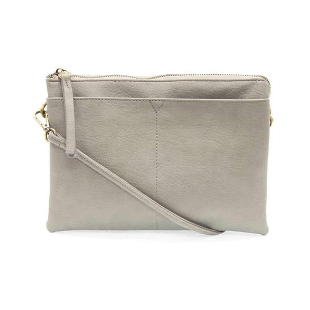 A light gray leather Joy Susan Gia Medium Multi Pocket Bag with a detachable strap and a top zip closure, displayed against a white background.