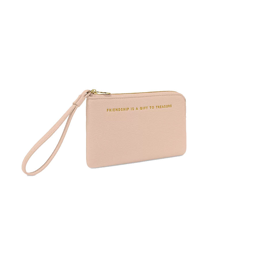 A Katie Loxton nude pink Positivity Pouch wristlet clutch with a gold zipper and the inscription "friendship is a gift to treasure" on one side.