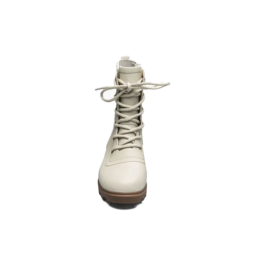 A single beige lace-up boot with a chunky sole and Bogs Rebound Cushioning, isolated on a white background.