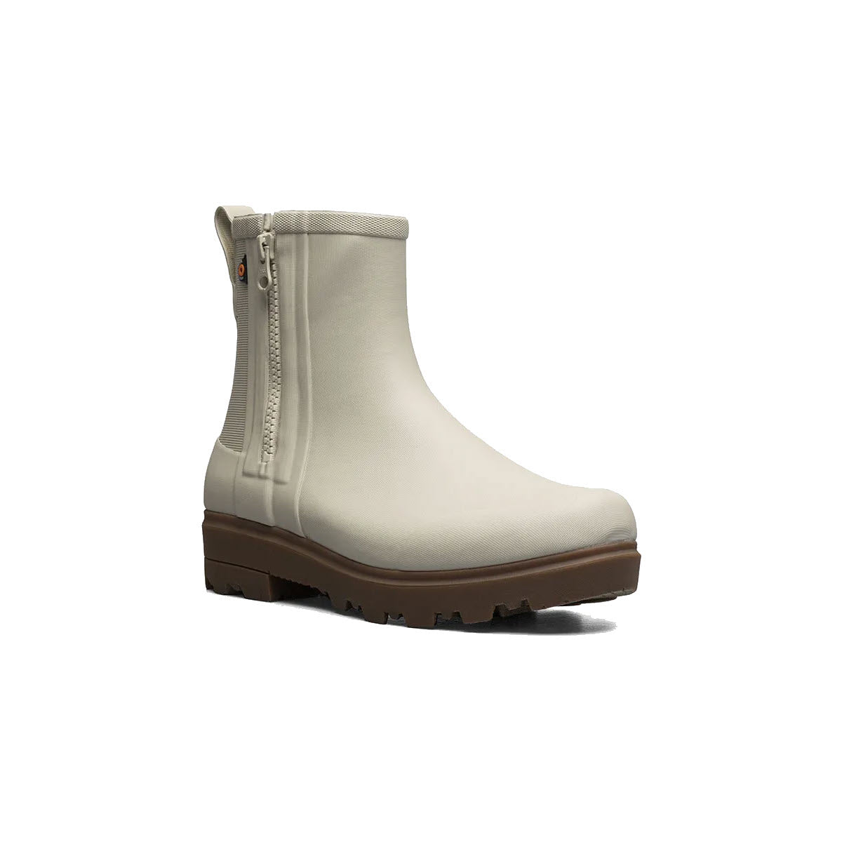 A light beige chelsea boot with elastic side panels and a zipper, featuring a chunky brown sole and Bogs Rebound Cushioning.