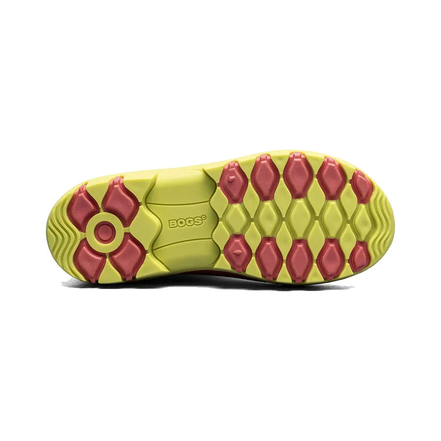 Sentence with replacement: Sole of a Bogs shoe with green and red hexagonal tread pattern, featuring the logo &quot;bogs&quot; in the center, designed with space-age seamless construction.