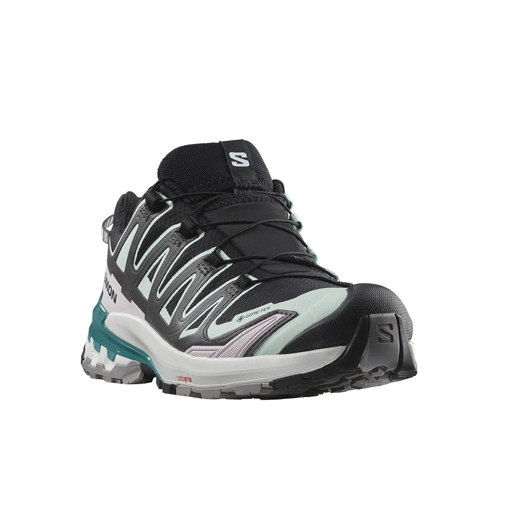 A Salomon XA PRO 3D V9 GTX trail running shoe in black, bleached aqua, and harbor blue accents, featuring a rugged sole and a waterproof GORE-TEX membrane, with the brand&#39;s logo on the side.