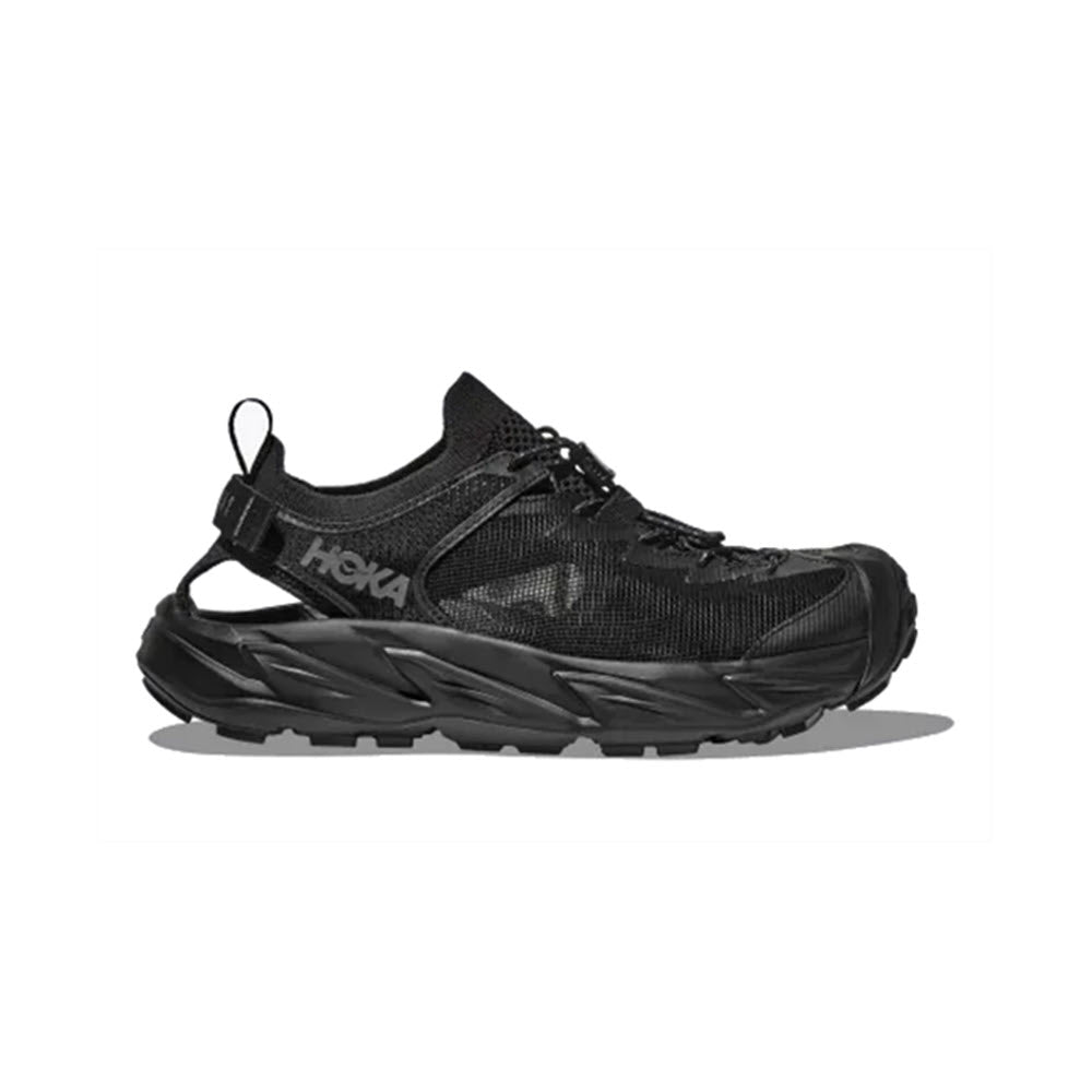 A black HOKA HOPARA 2 trail running shoe displayed against a white background, featuring a prominent Hoka logo and a rugged, water-repellency sole design.
