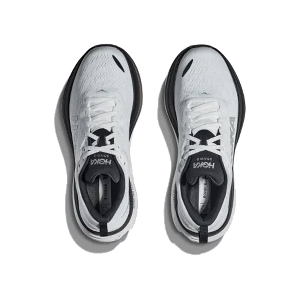 Top view of a pair of white Hoka Bondi 8 running shoes with black accents, displayed on a white background.