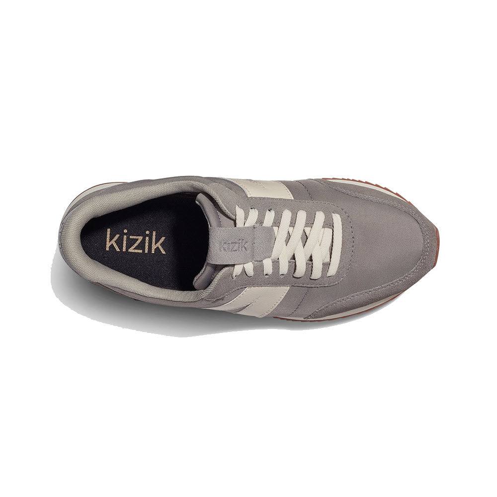 Top view of a gray Kizik Milan Granite sneaker with white laces and beige details.