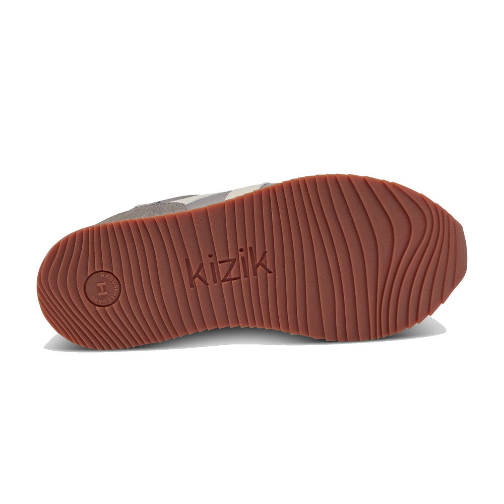 Brown KIZIK MILAN GRANITE shoe sole with horizontal ridges and the brand name &quot;Kizik&quot; embossed in the center.