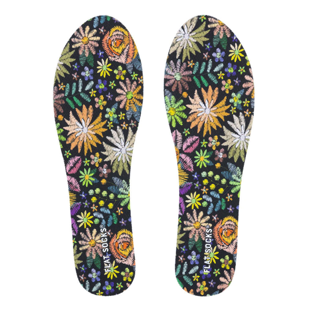 A pair of FLAT SOCKS FLORAL EMBROIDERY - WOMENS with vibrant flowers and &quot;stinky stopper&quot; text, isolated on a white background.