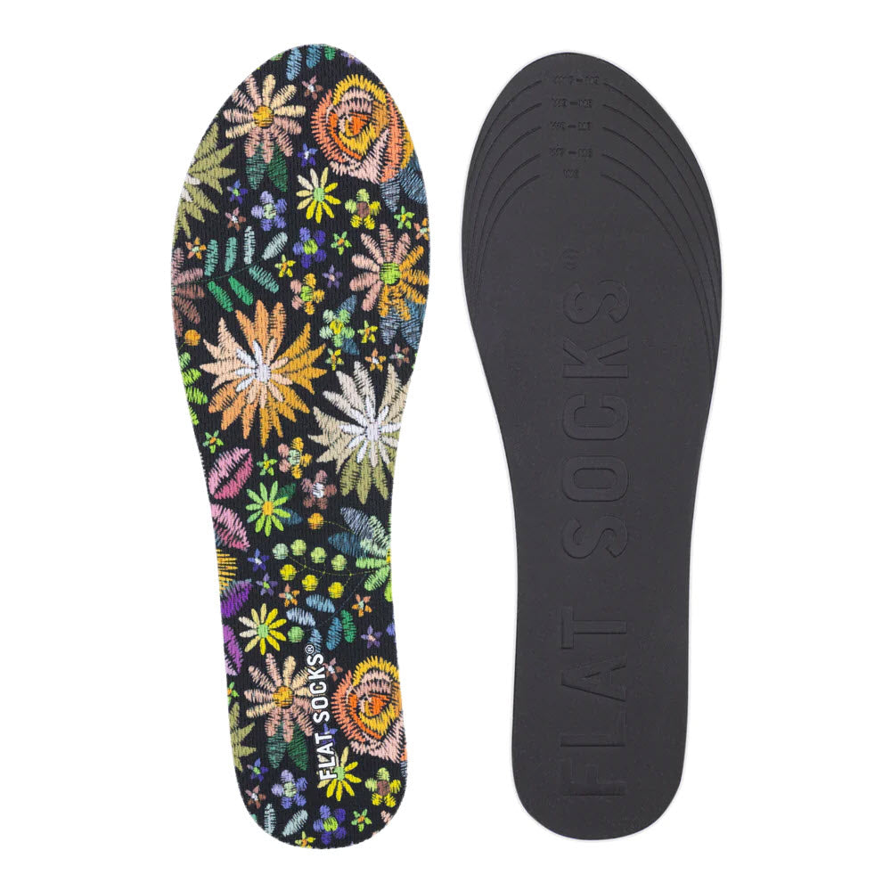 Two Flat Socks insoles; one is brightly decorated with floral embroidery, and the other is solid black with &quot;FLAT SOCKS&quot; embossed on it.