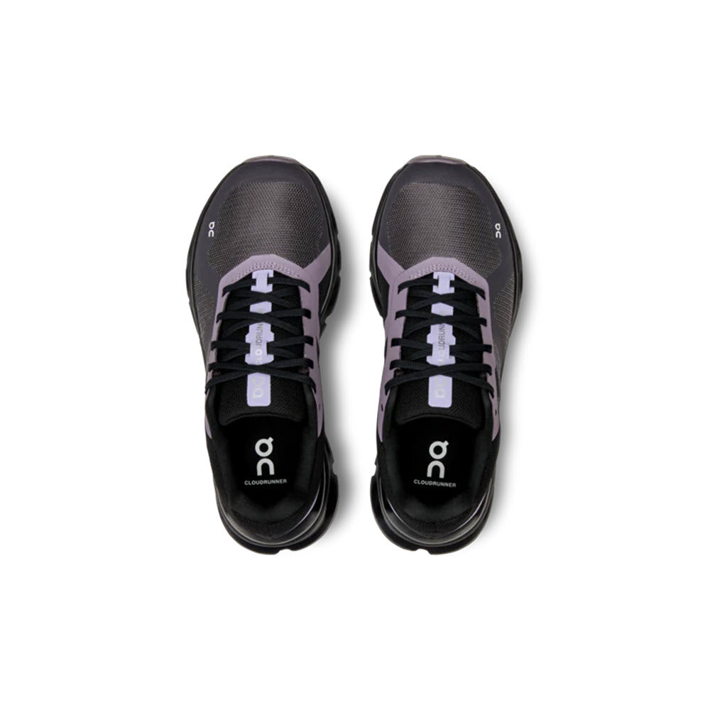 A pair of black and purple On Running Cloudrunner Iron/Black running shoes, viewed from above with laces visible, isolated on a white background.