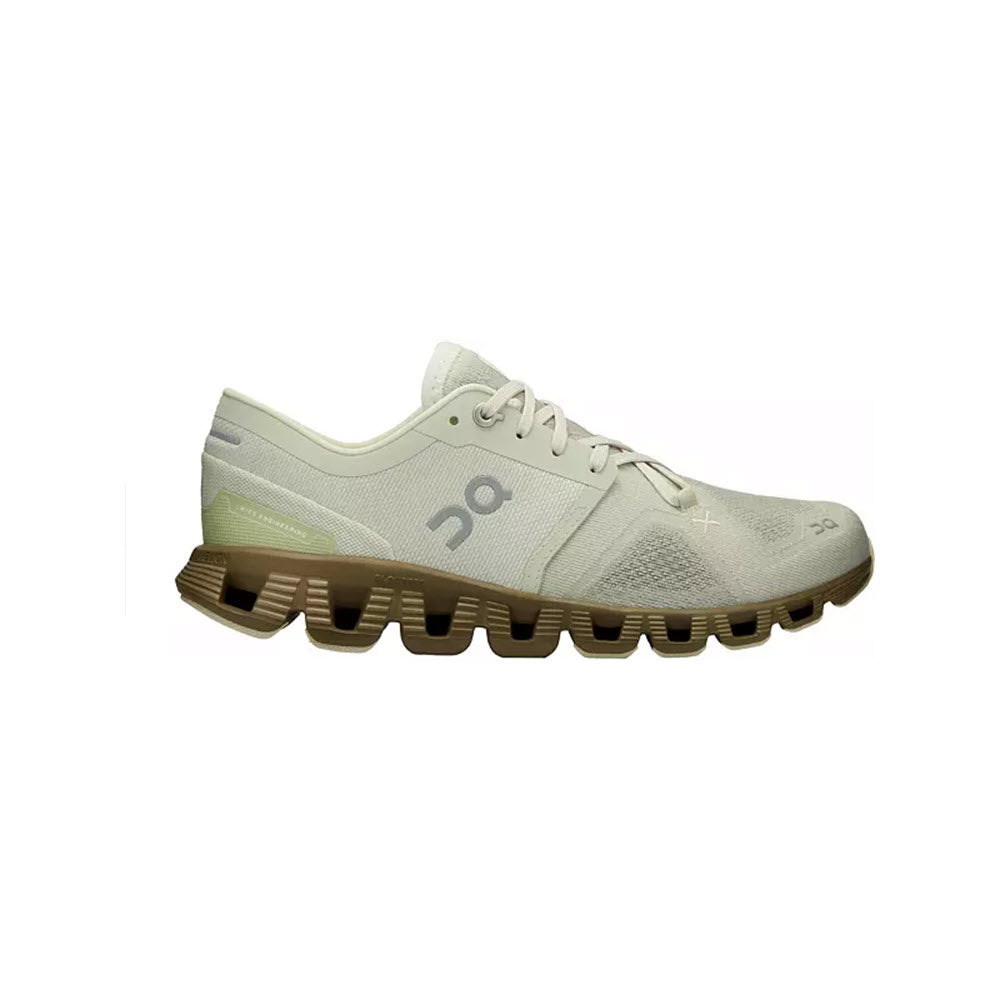 Side view of a On Running ON CLOUD X ALOE/HUNTER - WOMENS sneaker with unique chunky, segmented soles and lace-up design, featuring responsive cushioning.