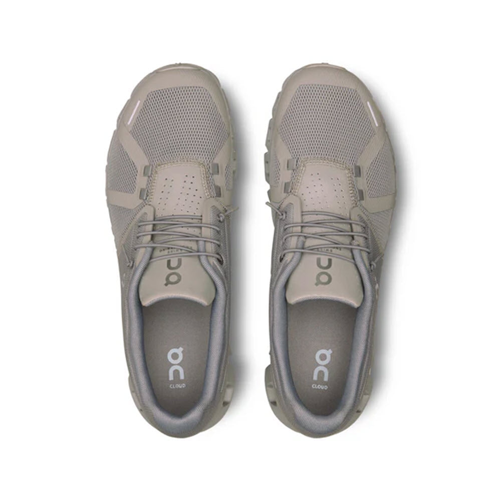 A pair of ON CLOUD 5 FOG/ALLOY - MENS sneakers displayed from above, with visible speed lacing system and On Running branding on the insoles.