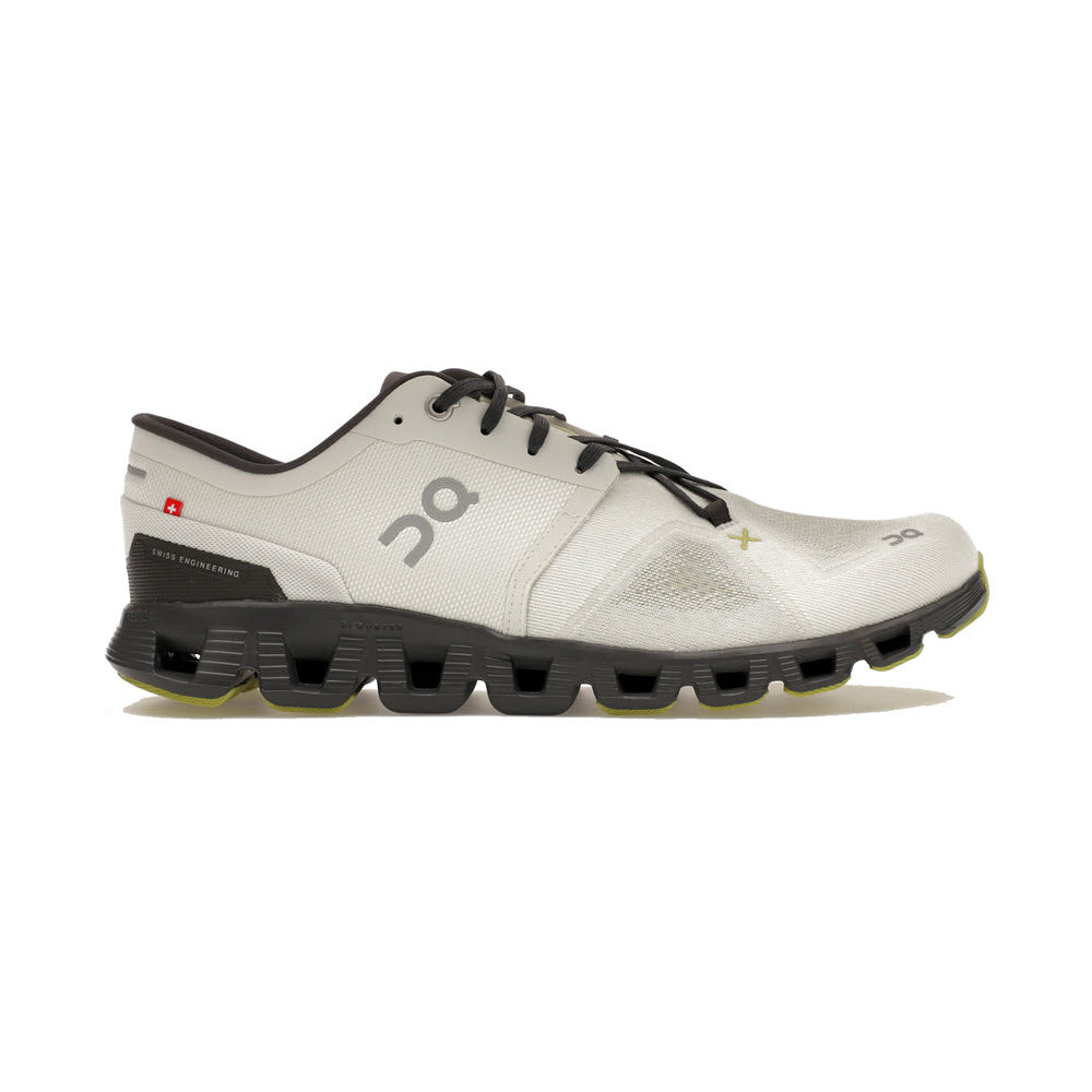 White and gray On Running ON CLOUD X 3 ICE/ECLIPSE Men&#39;s sneaker with distinctive thick black sole featuring CloudTec® cushioning, displaying the number &quot;20&quot; branding near the laces.