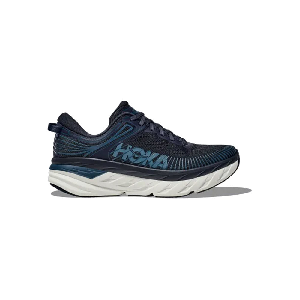 A dark blue athletic running shoe with a thick white sole and light blue accents, featuring the HOKA logo on the side, shown in a profile view on a white background.