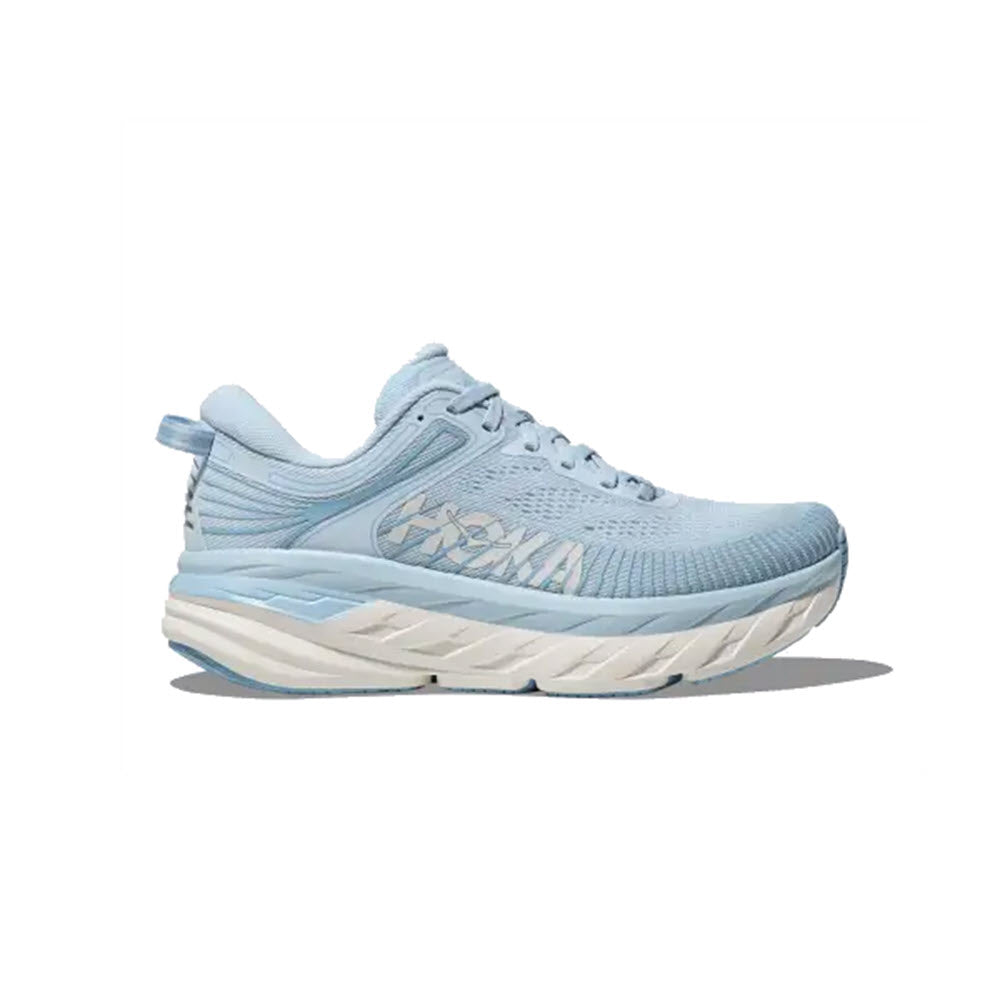 A light blue HOKA Bondi 7 ICE WATER/WHITE - WOMENS with cushioned sole and laces, displayed against a plain white background.