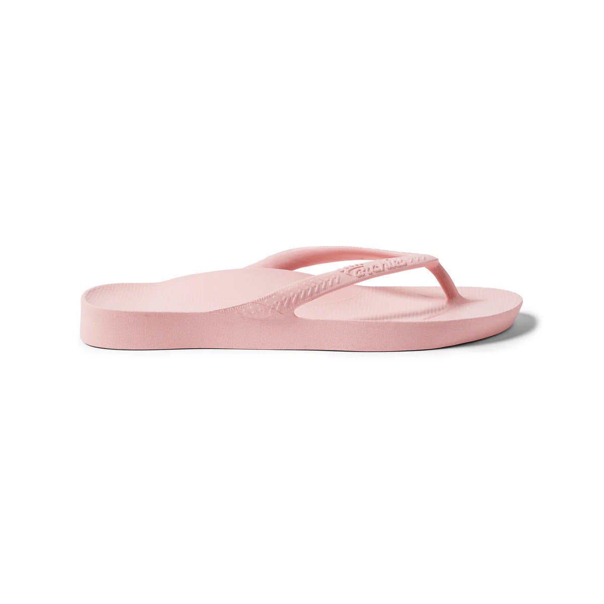 The Archies Flip Flops Pink - Womens sandal by Archies is displayed from the side on a plain white background, featuring orthotic support in a light pink color.