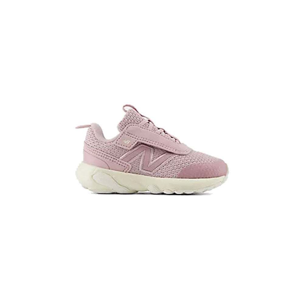 The New Balance 1440 Infant Twilight Haze sneaker for kids features a pink mesh upper, suede overlays, and a white chunky FuelCell midsole, shown on a plain white background.