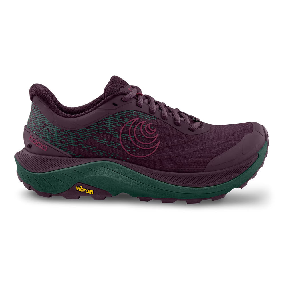 The Topo Ultraventure 4 Purple/Dark Teal - Womens is a trail runner with a maroon upper, green ZipFoam™ midsole, black Vibram® XS Trek EVO outsole for superior grip, and features a circular Topo logo.