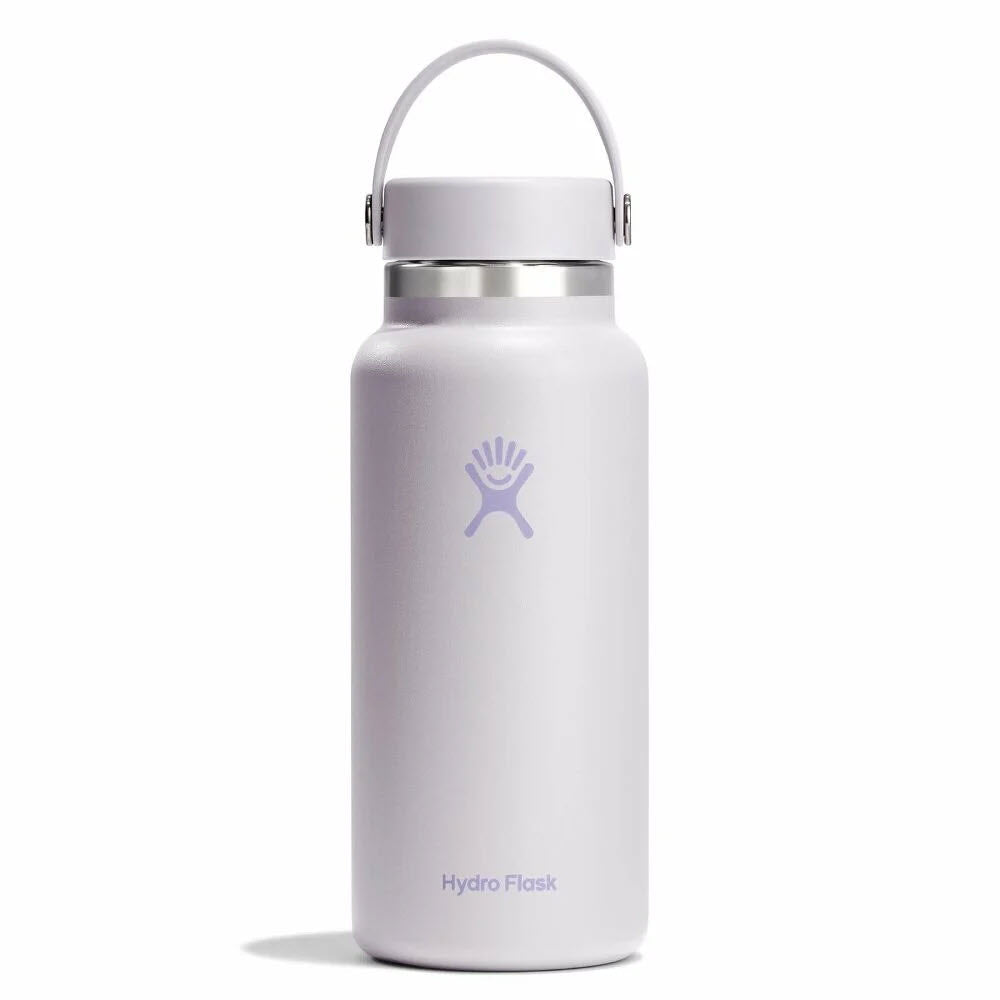 A white Hydro Flask water bottle with a handle on the lid, featuring the Hydro Flask logo and brand name on the front.
