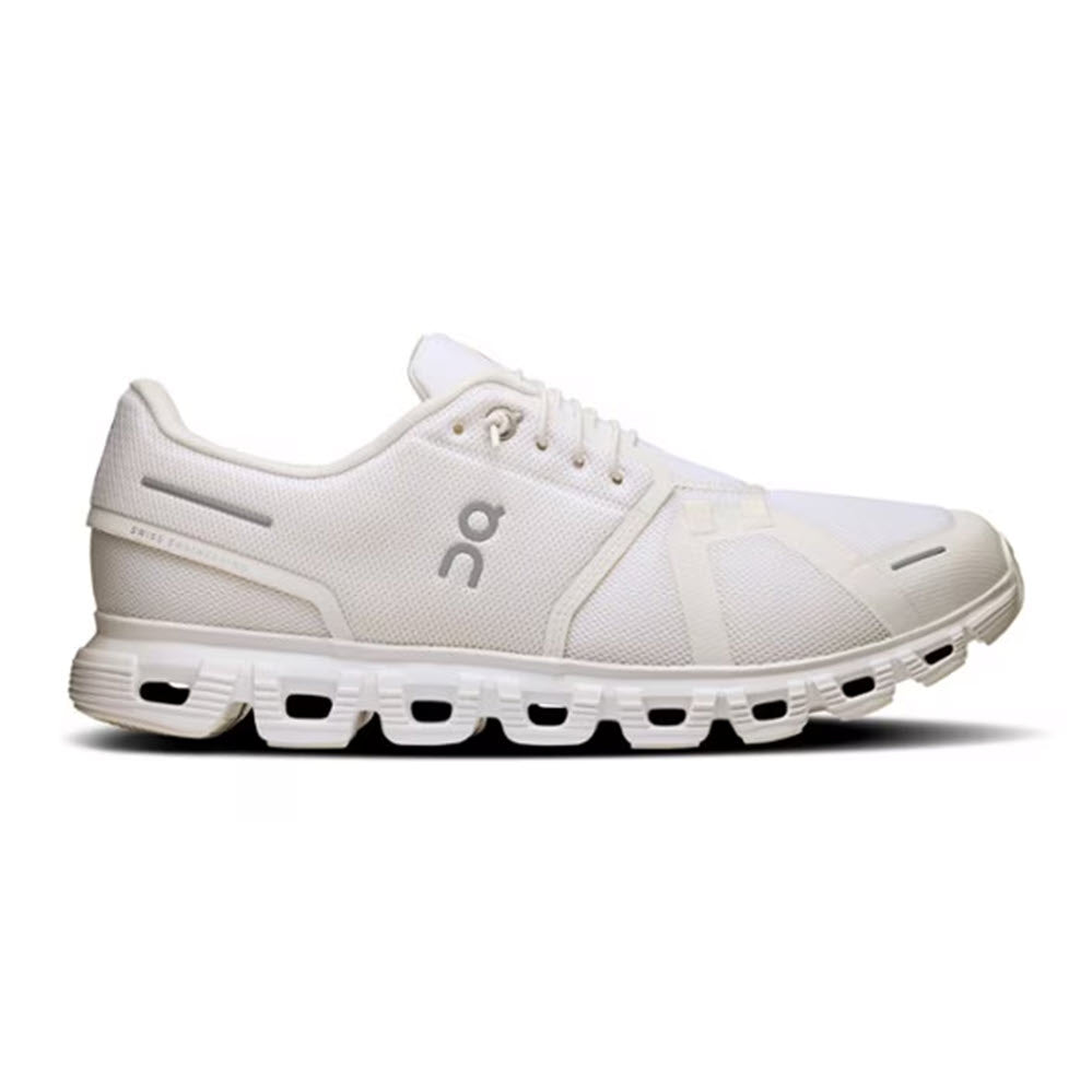 The ON CLOUD 6 WHITE/WHITE - MENS by On Running features a white athletic design with mesh panels, unique sole cutouts, and the On logo, providing cushioned comfort and style for mens running performance.
