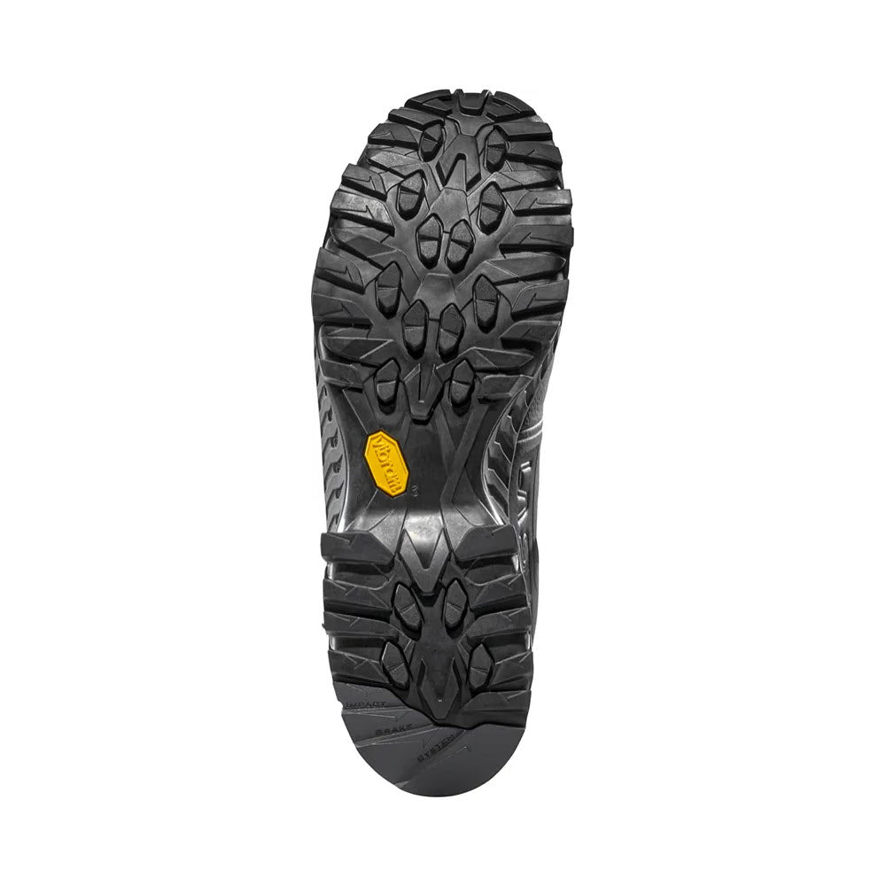 The image shows the black rubber sole of the La Sportiva Spire GTX Black/Carbon mens hiking shoe, featuring deep rugged treads and a central yellow Vibram logo, displayed against a plain white background.