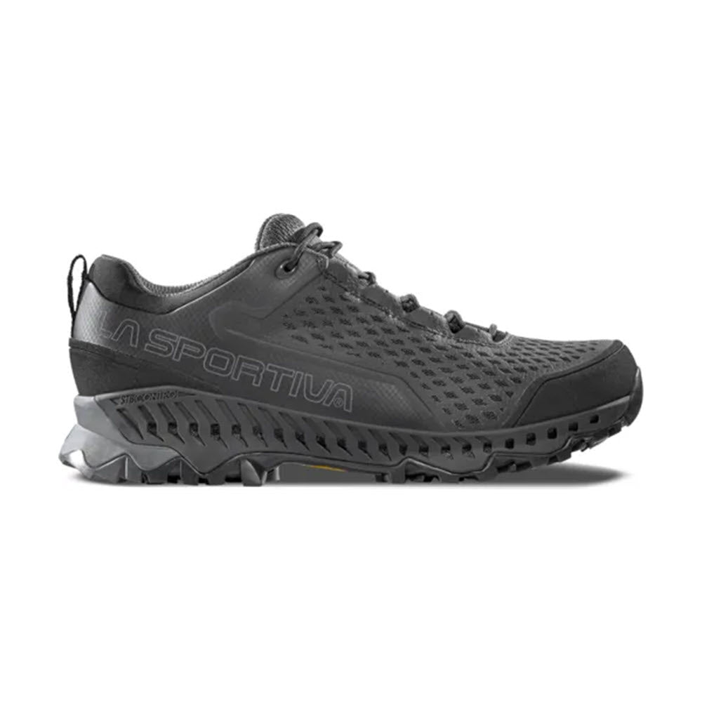 The LA SPORTIVA SPIRE GTX BLACK/CARBON - MENS is a black La Sportiva hiking shoe with Gore-Tex Surround, rugged sole, mesh upper, and lace-up design, shown in side profile on a white background.