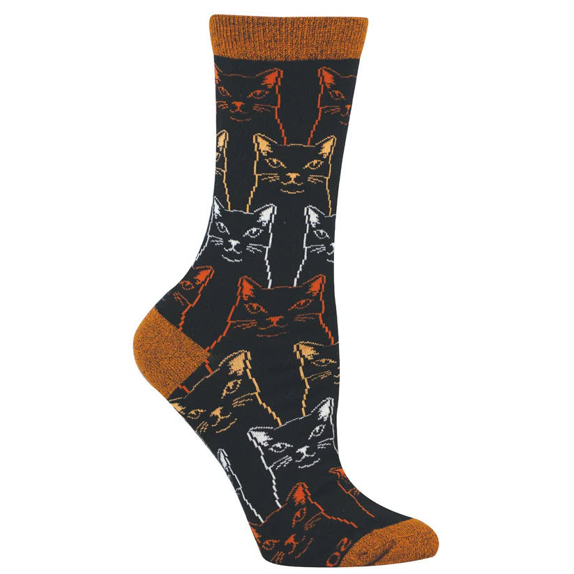 A black sock with orange, white, and tan cat faces in a repeating pattern. The toe, heel, and cuff are solid orange.