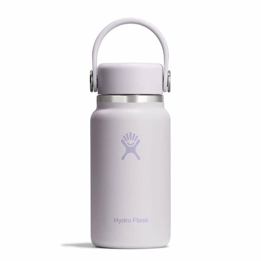 A light purple Hydro Flask water bottle with a handle on the lid, featuring the Hydro Flask logo and brand name on the front, set against a plain white background.