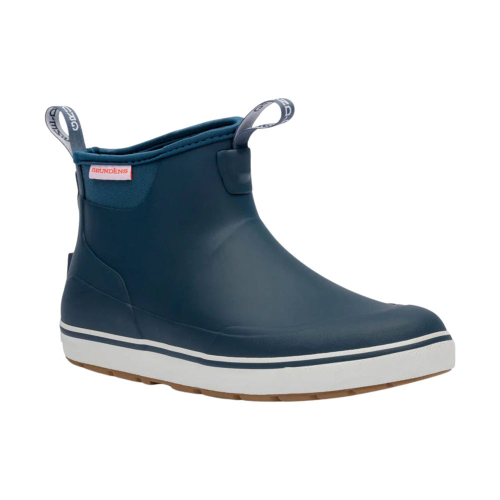 A single navy blue rubber ankle rain boot with a white sole, brown tread, and pull tabs on the front and back. The boot has a sleek design with minimal detailing.
