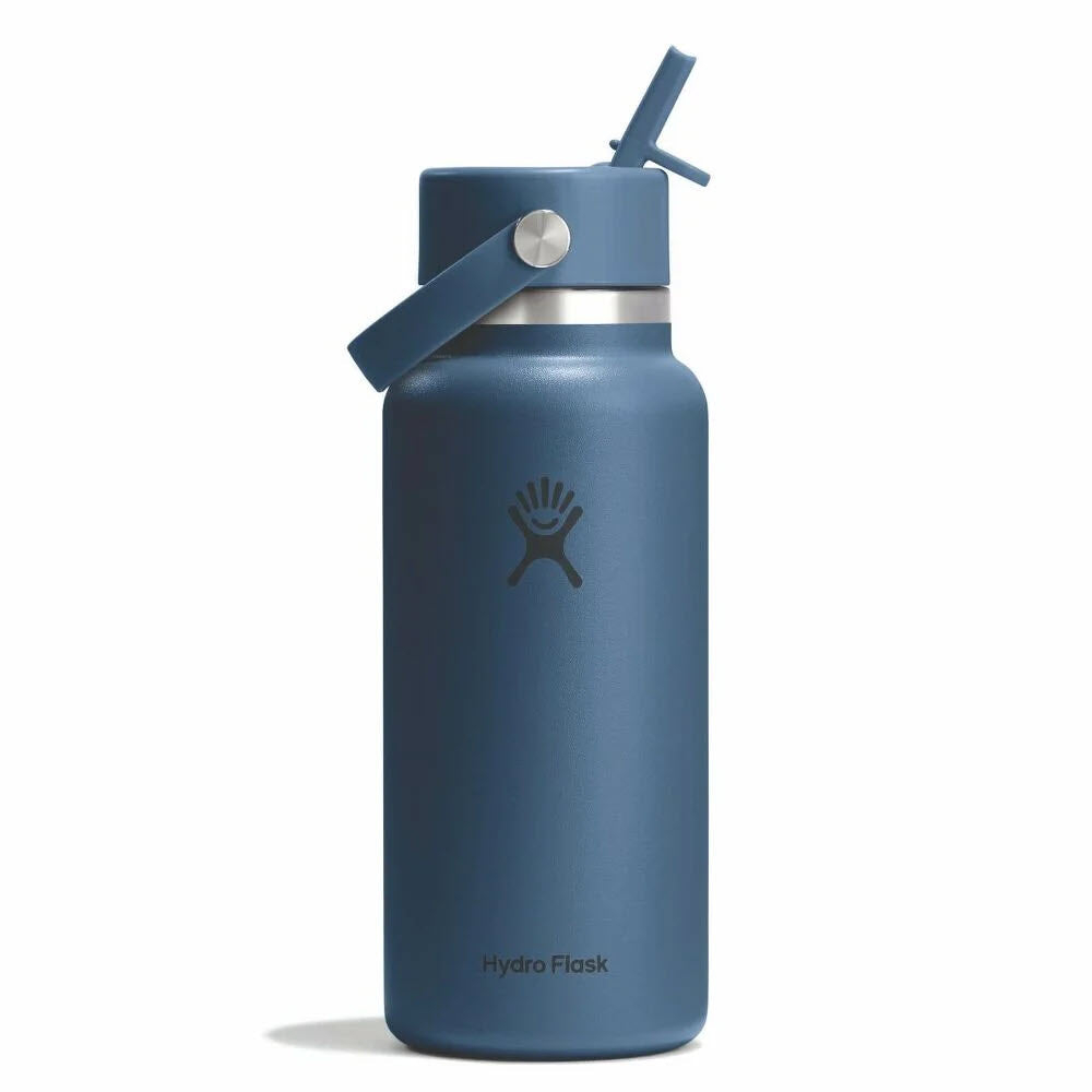 A blue Hydro Flask water bottle with a straw lid and carrying handle, featuring the Hydro Flask logo on the front.