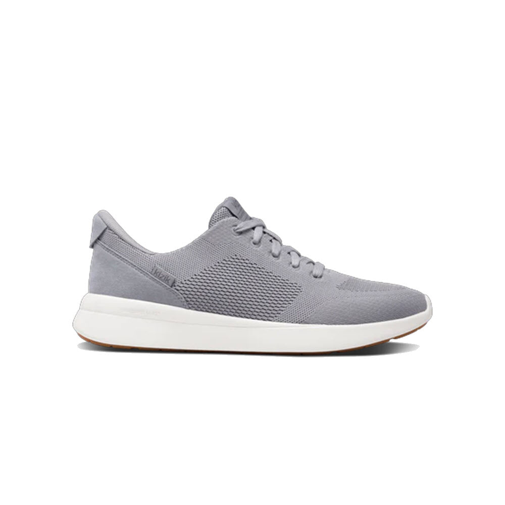 A gray athletic sneaker with a mesh upper, lace-up design, and a white rubber sole, shown in a side profile against a plain white background.