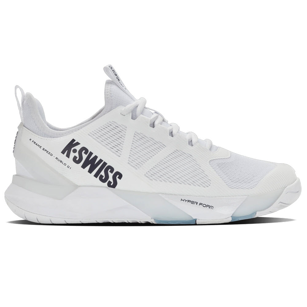A white K-Swiss athletic sneaker with mesh panels, a thick sole, and K-SWISS branding in bold black letters on the side. The shoe has a modern, sleek design with subtle gray accents and a pull tab on the heel.