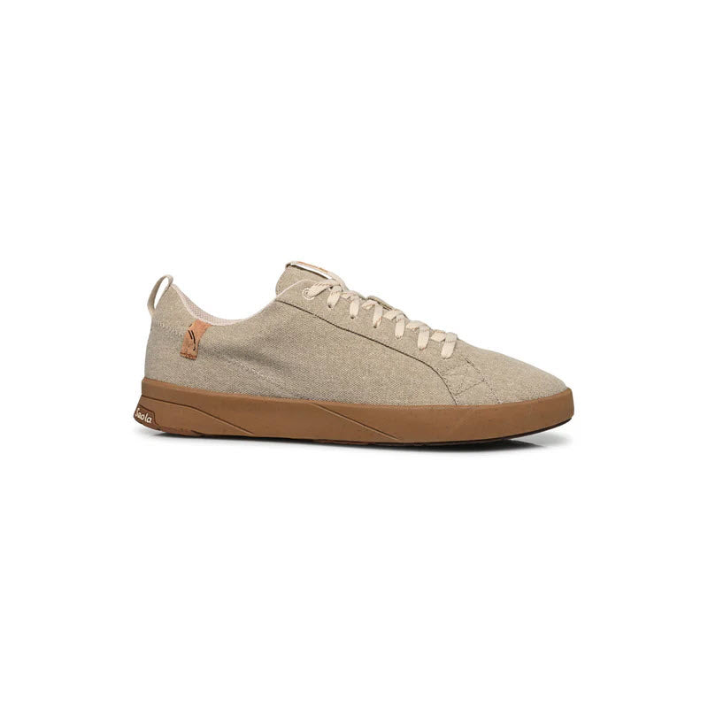 A beige canvas sneaker with matching beige laces and a light brown rubber sole, shown in a side profile view on a white background.