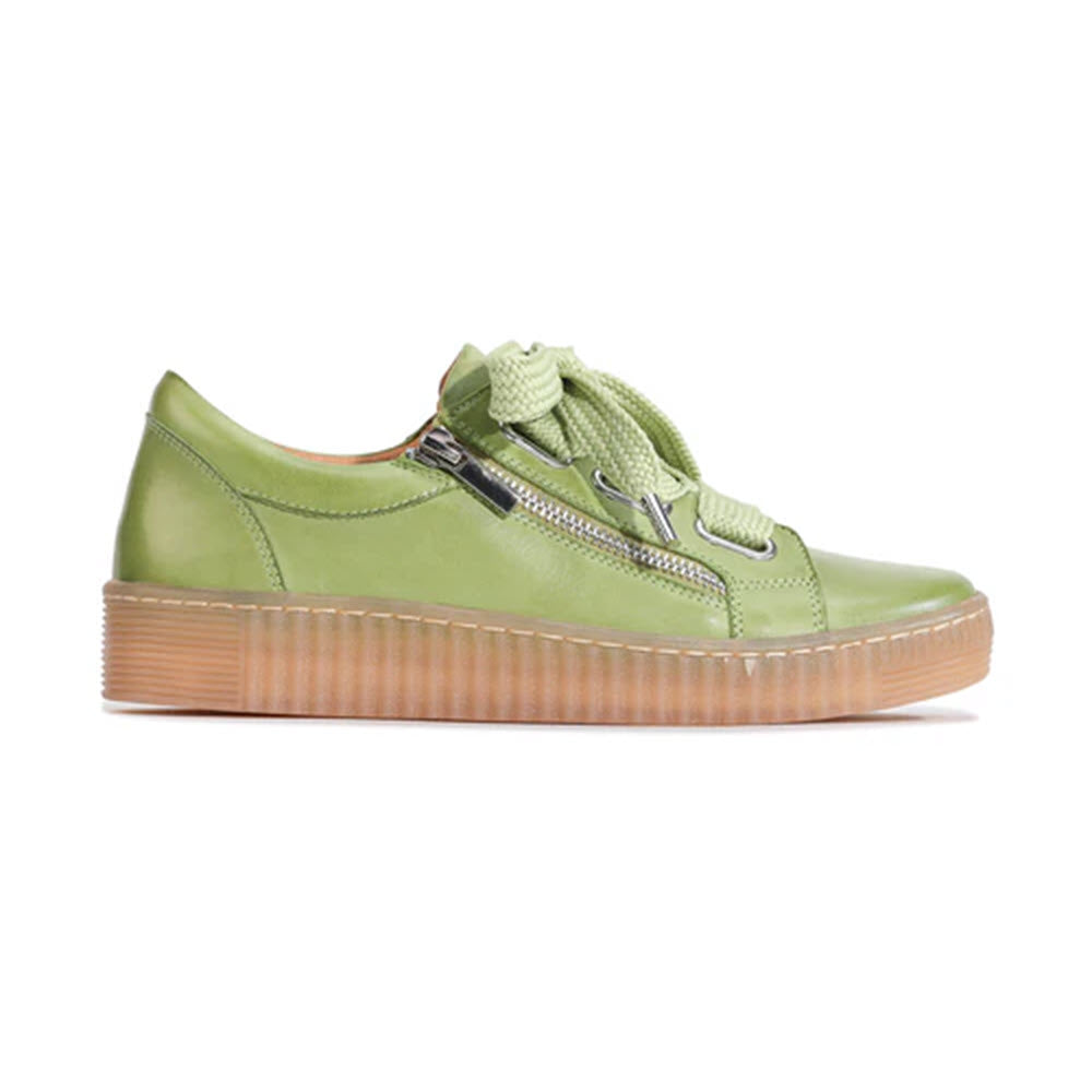 A lime green leather sneaker with thick laces, a side zipper, and a brown ribbed rubber sole, viewed from the side against a white background.