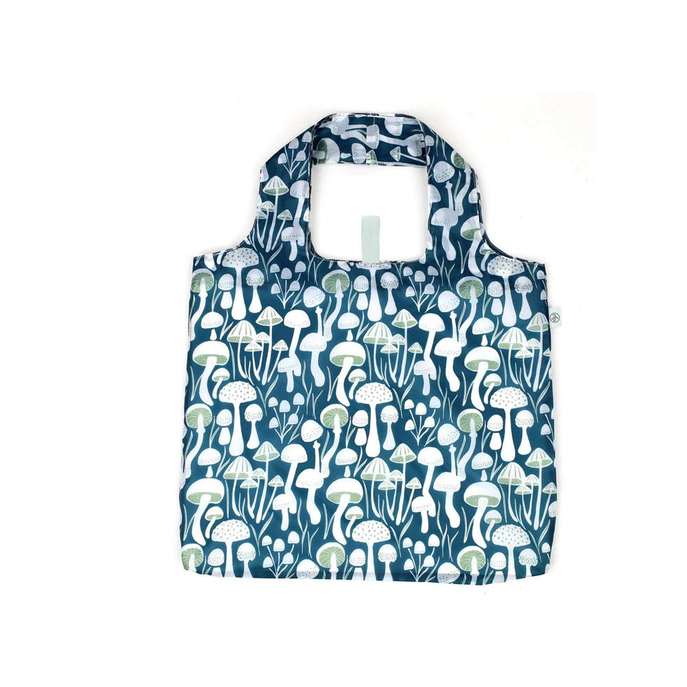 Reusable shopping bag with a pattern of white and light green mushrooms on a dark teal background, shown on a plain white surface.