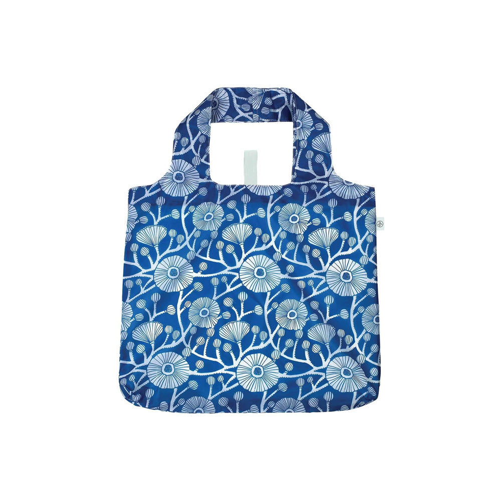 Blue reusable shopping bag with wide handles, featuring a white floral and leaf pattern on the front. The bag is displayed against a plain white background.