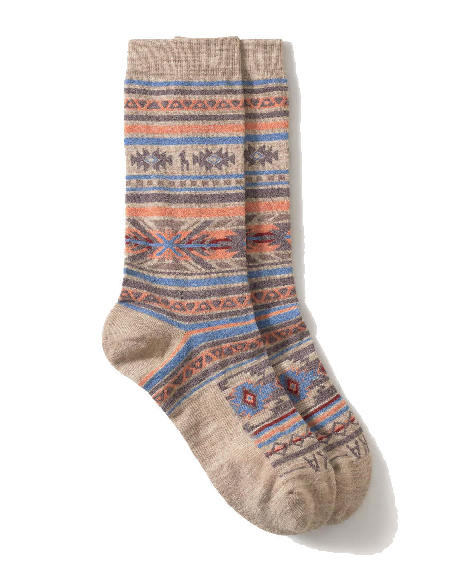 A pair of beige socks featuring colorful geometric and tribal-inspired patterns in orange, blue, and brown tones, laid flat with one sock slightly overlapping the other.