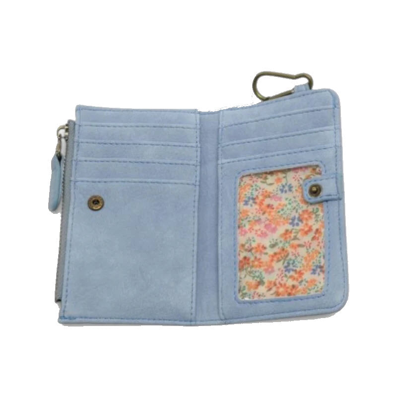 Light blue wallet with card slots, a snap button pocket, a clear ID window with a floral patterned insert, and a metal clasp on the edge. The wallet is open and photographed against a white background.