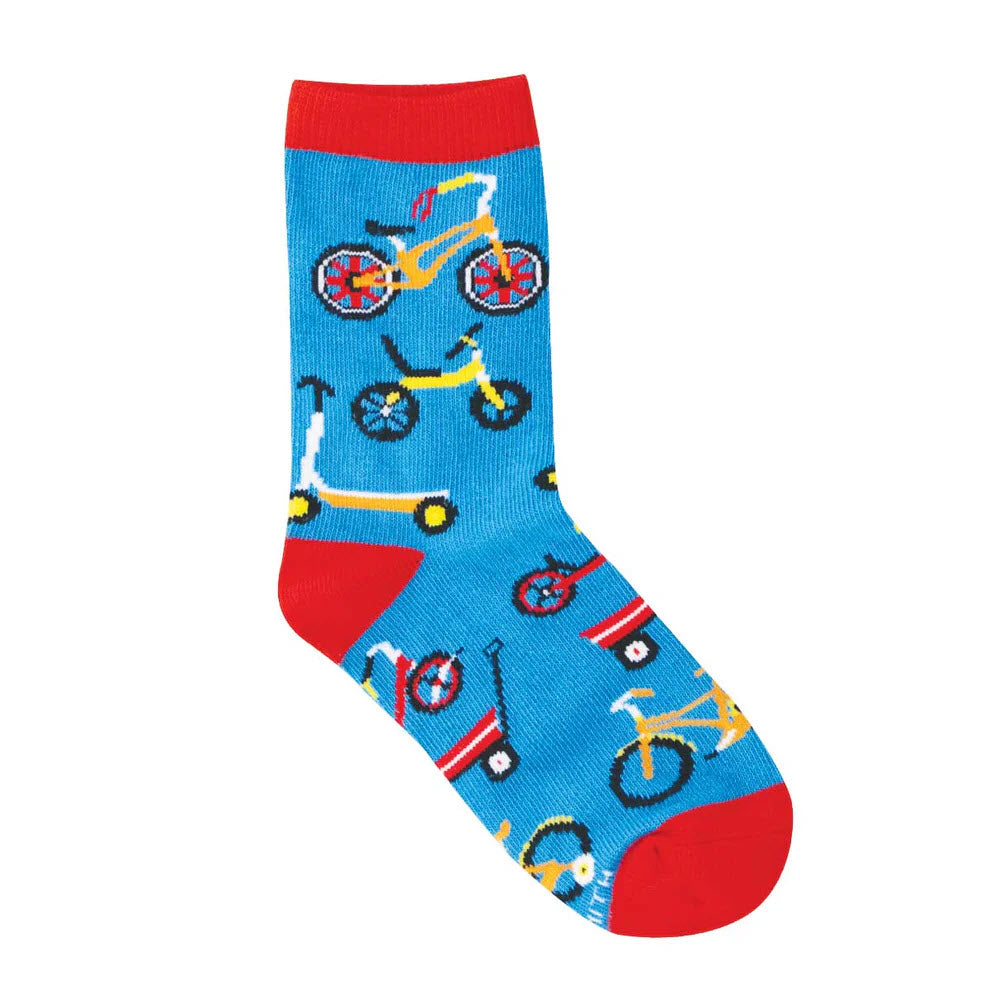 A blue sock with red heel, toe, and cuff, decorated with colorful illustrations of bicycles, scooters, and red wagons.