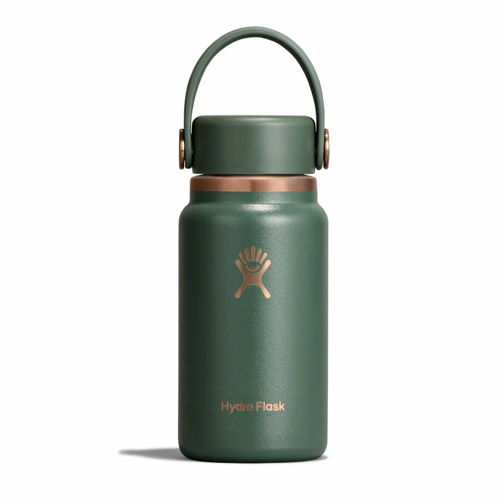 A green Hydro Flask water bottle with a gold logo and lid, featuring a sturdy carrying handle, is shown against a plain white background.