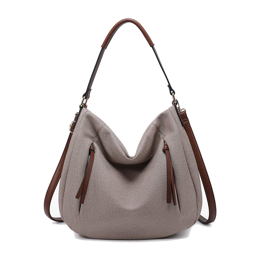 A taupe hobo-style handbag with a slouchy shape, brown handle and adjustable shoulder strap, and two front zippered pockets with long brown tassel pulls.