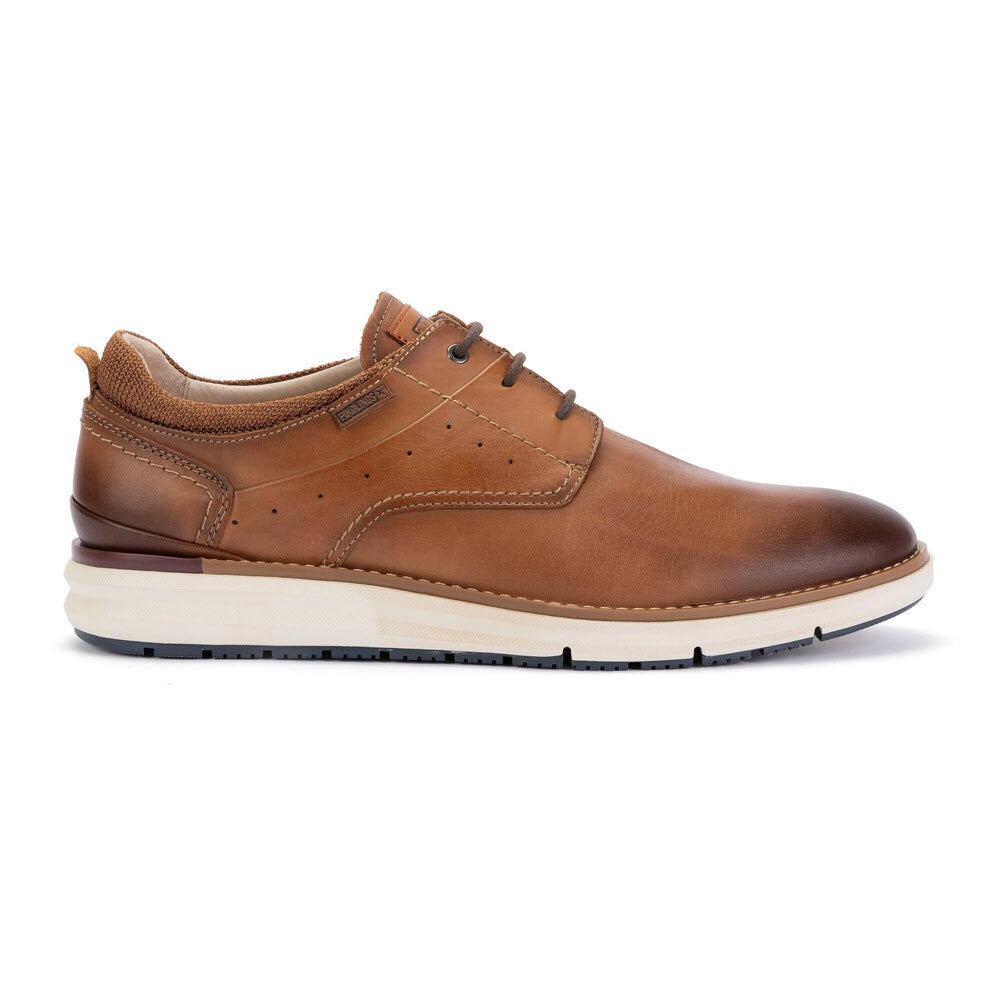 A brown leather mens dress shoe with laces, perforated detailing, and a white and brown rubber sole, displayed in a side profile view against a white background.