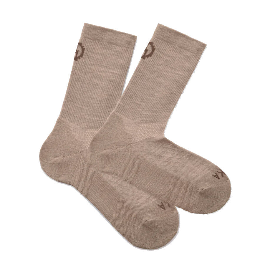A pair of beige crew socks with a subtle ribbed texture and small brown logos near the cuffs and toes. The socks are laid flat and slightly overlapping on a white background.