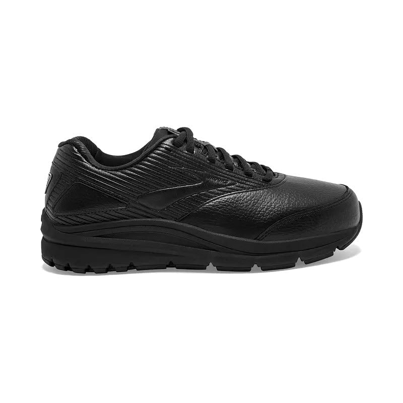 A black athletic sneaker with a BioMoGo DNA midsole and a thick rubber sole, viewed from its lateral side, Brooks Addiction Walker 2 Lace Black - Mens.